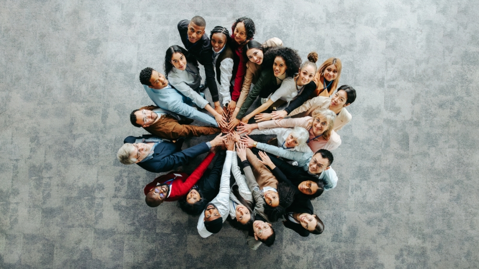 Top,View,Of,A,Diverse,Team,Of,People,Joining,Hands