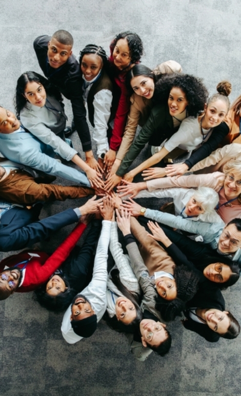 Top,View,Of,A,Diverse,Team,Of,People,Joining,Hands